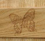 Engraved detail in Oak.